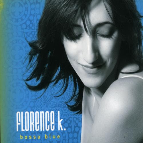 Florence K, a singer, poses with her eyes closed for her Bossa Blue album cover.
