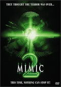 The Mimic 2 movie poster features a shadowy figure illuminated by green light, evoking a sense of horror and suspense.
