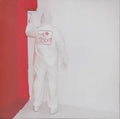 Painter in white suit repaints the Red Room wall white, covering the original color.
