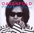 DJ Paul Oakenfold poses for his Perfecto Vegas album cover, wearing sunglasses and a striped shirt.
