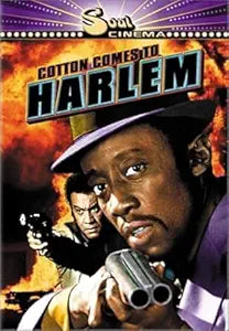 Movie poster for "Cotton Comes to Harlem" features a man in a fedora holding a double-barreled shotgun as another man aims a pistol behind him.
