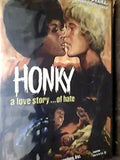 "Honky" movie poster depicts a Black man and a White man kissing, subtitled "a love story...of hate," promoting a controversial racial drama.
