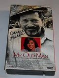 Close-up shows the vintage VHS tape of "My Old Man," featuring the cover's artwork of Warren Oates and Kristy McNichol, a beloved family drama film.
