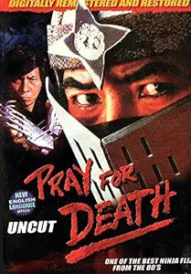 Ninja warrior wielding a blade glares intensely on the vintage "Pray for Death" movie poster.
