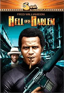 Fred Williamson stars in the Hell Up in Harlem movie poster, gripping a weapon and facing forward while another man in a hat lurks behind him.
