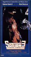 Farrah Fawcett appears distressed as a robot hand looms near her face in the Saturn 3 science fiction movie poster.
