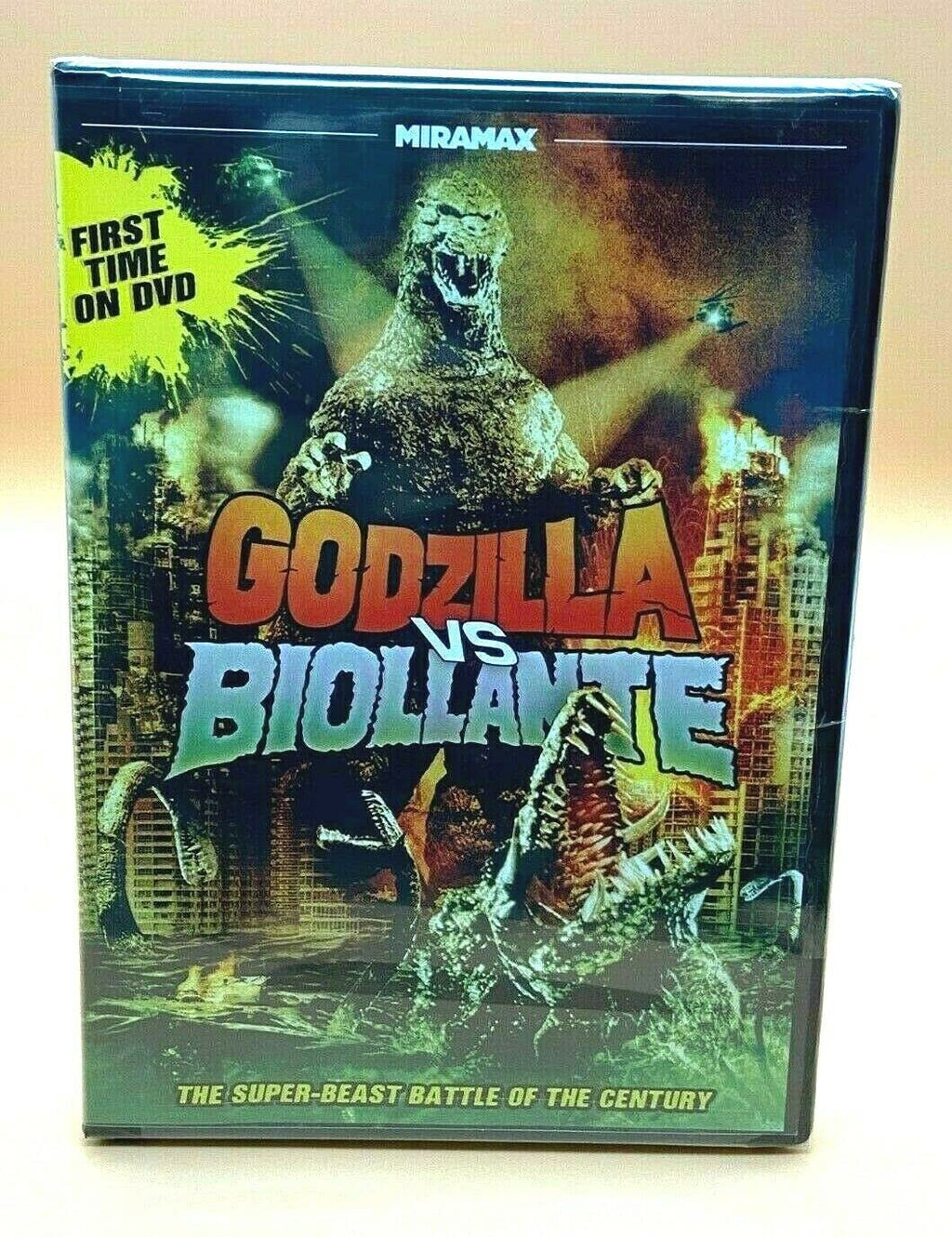 A "Godzilla vs. Biollante" DVD case displays the iconic monster battling a plant-like creature amidst a burning cityscape.
