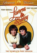 The DVD cover for Laverne & Shirley's first season features Penny Marshall and Cindy Williams smiling within a yellow circle.
