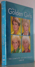 A still-sealed "The Golden Girls: The Complete Second Season" DVD box set displays the smiling faces of Dorothy, Blanche, Rose, and Sophia.
