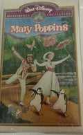 Mary Poppins and Bert dance cheerfully with penguins on the vintage Walt Disney Masterpiece Collection VHS cover.
