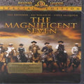 The Magnificent Seven DVD cover features Yul Brynner, Eli Wallach, and Steve McQueen leading a group of cowboys riding horses.
