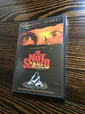 Close-up shows the "I'm Not Scared" thriller movie DVD cover featuring wide eyes and a surreal image.
