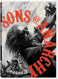 Viewers see the Sons of Anarchy Season 3 DVD cover featuring Jax riding his motorcycle with other bikers.
