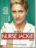 Edie Falco, as Nurse Jackie, stares intensely while holding a syringe on the promotional poster for Season One of the TV show.
