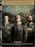 The "Foxcatcher" movie DVD cover features Steve Carell, Channing Tatum, and Mark Ruffalo, showcasing the drama film's multiple Academy Award nominations.
