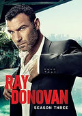 Liev Schreiber stars as Ray Donovan, looking intense on the season three poster with a city view background.

