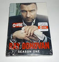 Showtime's Ray Donovan Season One DVD features Liev Schreiber looking intensely at the viewer, holding a white cloth.
