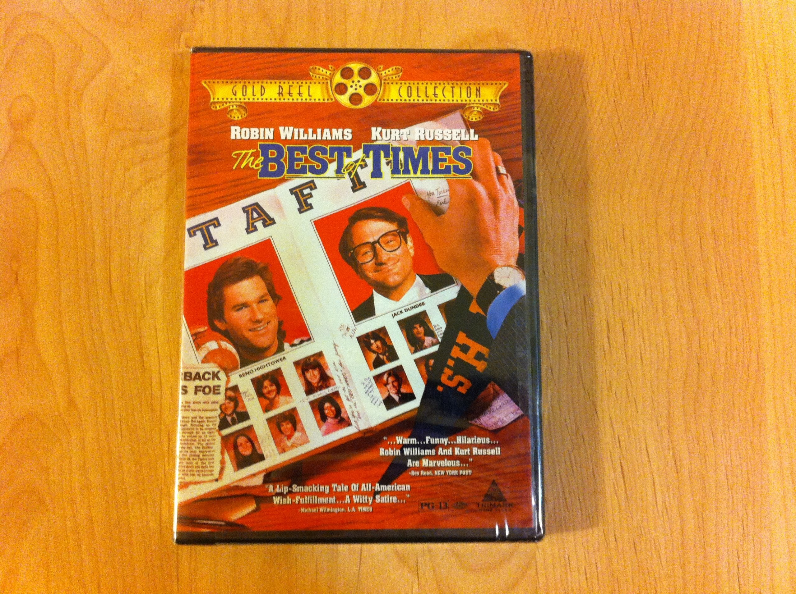 Close-up shows the DVD of "The Best of Times," starring Robin Williams and Kurt Russell, featuring a yearbook-style cover.