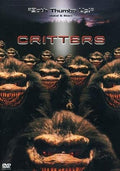Critters movie poster features a swarm of menacing, furry creatures with sharp teeth, promising 80s sci-fi horror fun.
