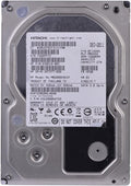 Inspect a 2TB Hitachi hard drive with a label showing its technical specifications and production date.
