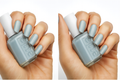 Woman's hand holds Essie nail polish bottle, showcasing grey-blue painted nails.
