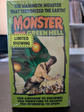 A vintage VHS tape for the "Monster from Green Hell" movie shows a man fleeing from a giant, menacing green monster as natives with spears pursue him.
