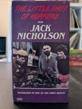 The vintage VHS tape of "The Little Shop of Horrors" features Jack Nicholson in one of his early roles.
