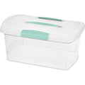 A translucent plastic storage container with a white lid and mint-green handles sits on a white surface.
