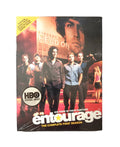 The HBO series "Entourage: The Complete First Season" DVD cover features the male cast walking in Hollywood with Vincent Chase's movie poster overhead.
