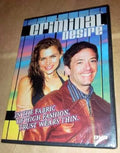 The Criminal Desire DVD cover features a woman and man smiling against a striped background.
