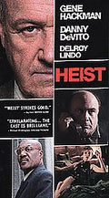 Movie poster advertises the action film "Heist" starring Gene Hackman, Danny DeVito, and Delroy Lindo.
