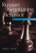 Book cover displays chess pieces on a board, promoting "Russian Negotiating Behavior: Continuity and Transition" by Jerrold L. Schecter.
