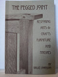 Book cover shows a pegged joint of wood furniture, advertising a guide to restoring Arts & Crafts furniture and finishes by Bruce Johnson.
