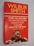 Wilbur Smith's book cover features a roaring lion and lists titles including "When the Lion Feeds" and "The Diamond Hunters."
